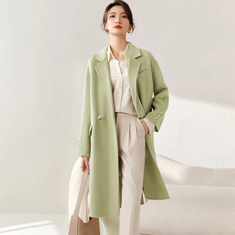 Women's double-sided wool coat in Spring Staccato color, featuring notch lapels, dropped shoulders, and a seamless, fluid silhouette. — From Borcelleclothes.