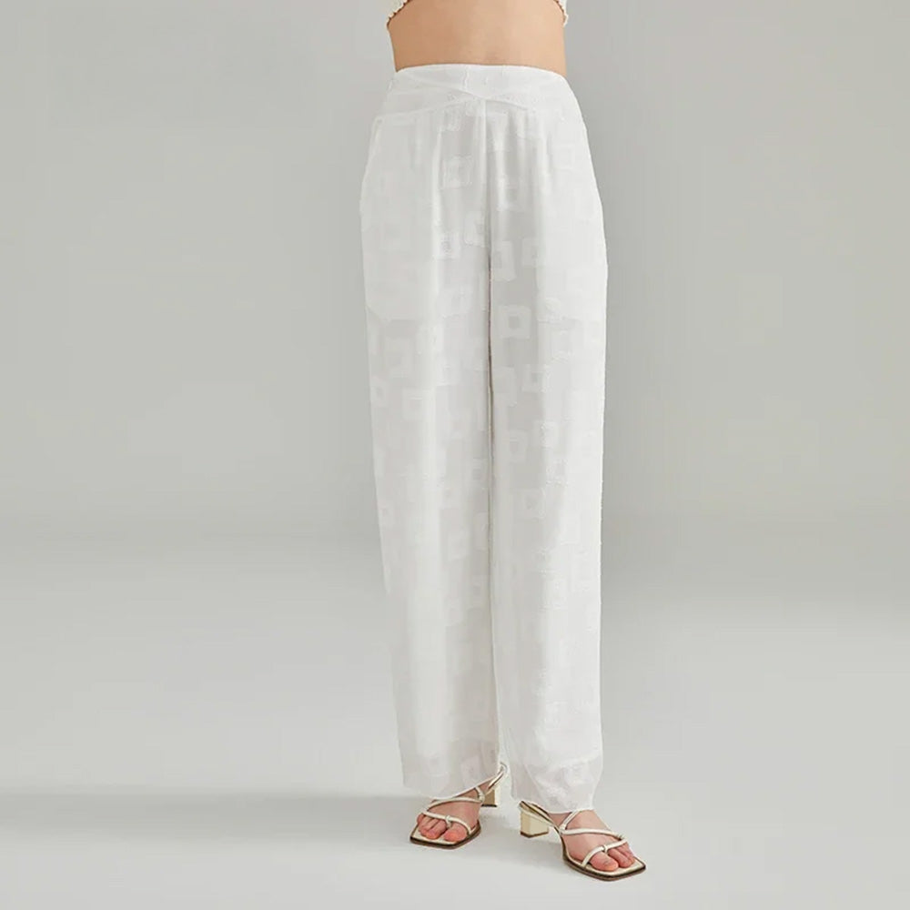 Women's Straight-leg silk trousers tailored in 100% Grade 6A Mulberry silk jacquard georgette. Featuring a geometric texture and a pasma bundle-stitch embroidered yoke. — From Borcelleclothes.