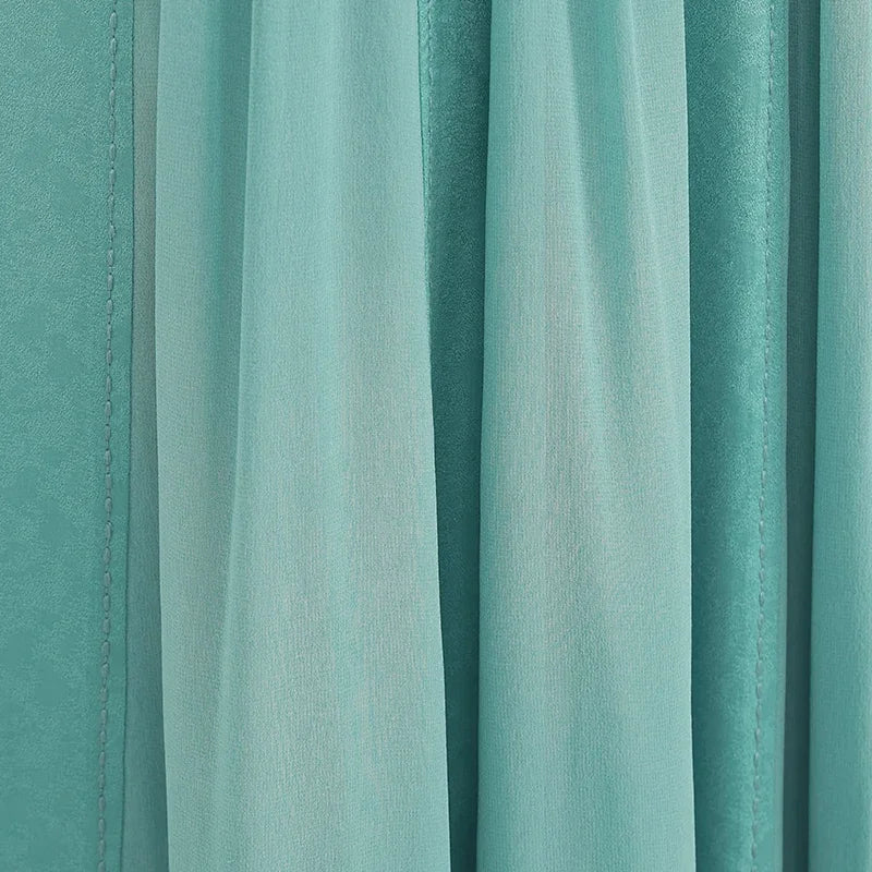 Detailed macro shot of the semi-sheer Mulberry silk georgette insert, delicately gathered and draped within the marble jacquard arch — From Borcelleclothes.