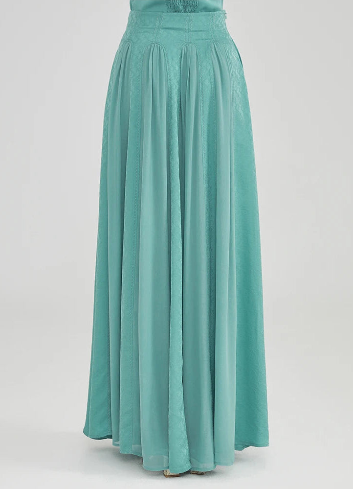 Back view of the high-waisted silk maxi skirt, demonstrating its flawless fit and majestic, floor-length silhouette — From Borcelleclothes.