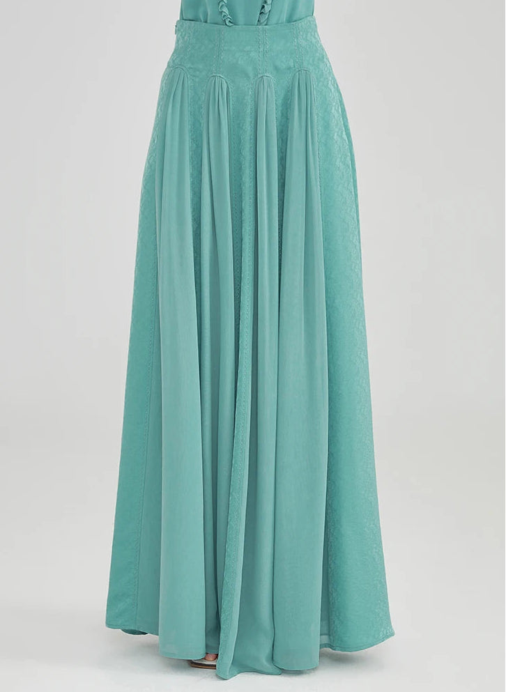 Front view of the architectural silk maxi skirt, highlighting the symmetry of the alternating marble jacquard and georgette panels — From Borcelleclothes.