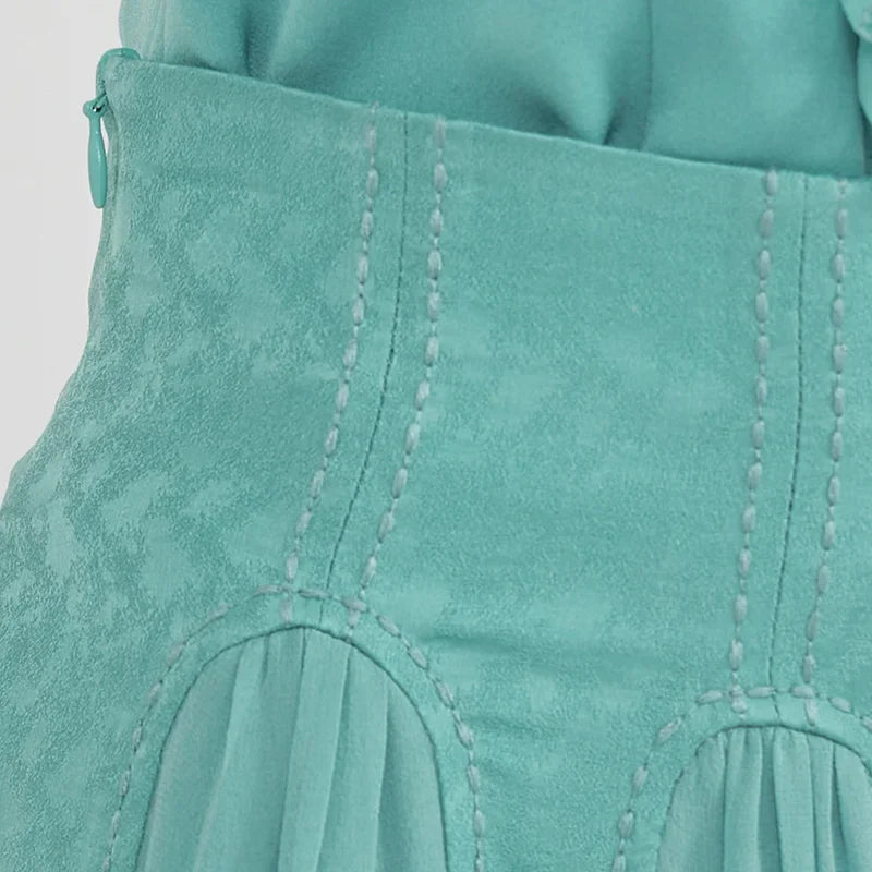 Side profile close-up of the high-waist section, featuring the immaculate panel construction and seamless invisible zipper closure — From Borcelleclothes.
