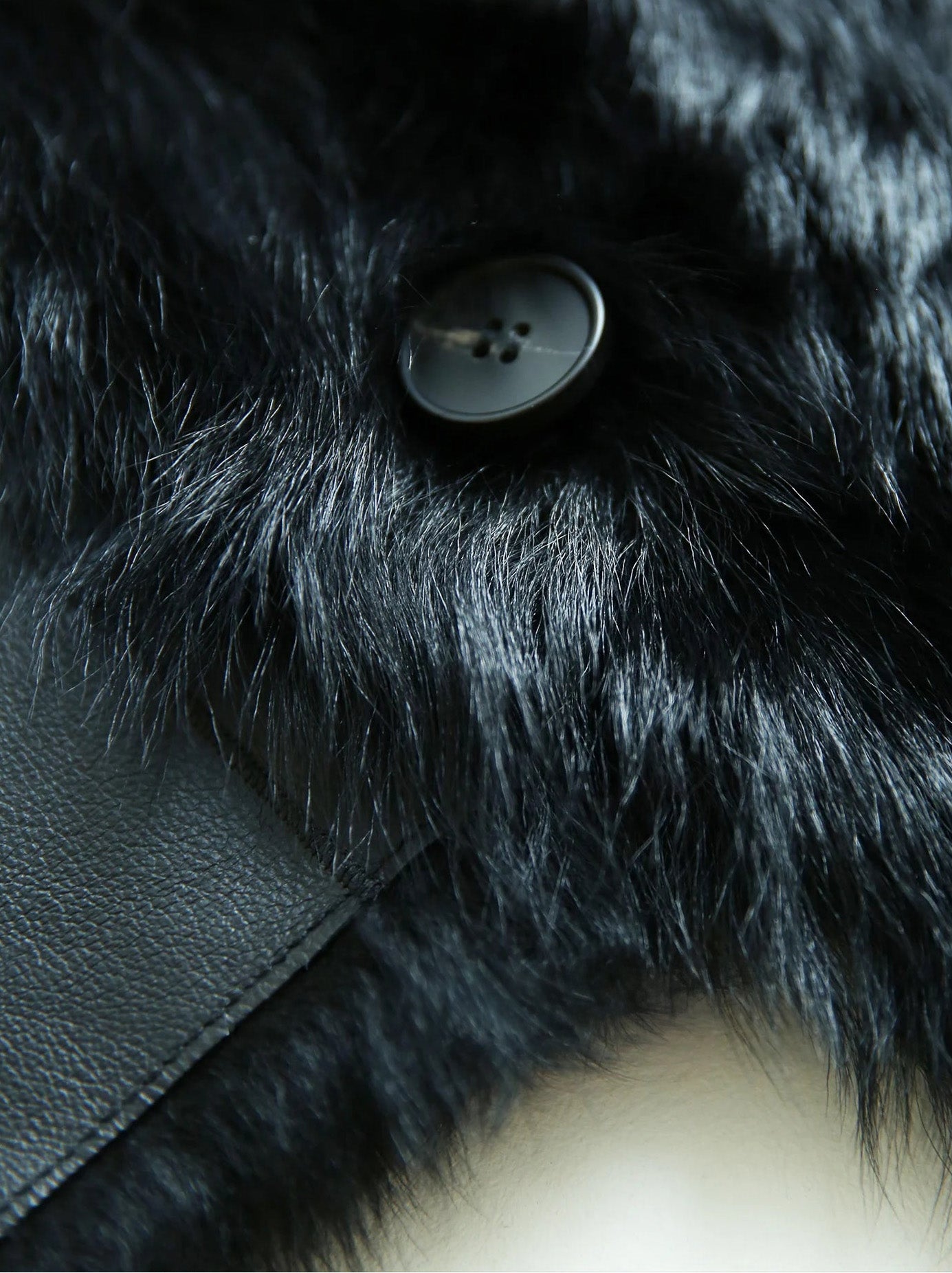 Detail of the fur surface and button area on the Autographe reversible jacket — From Borcelleclothes.