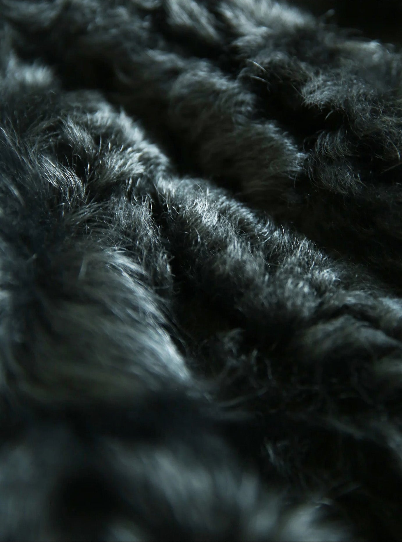 Close-up of the natural semi-curled wool texture of the Autographe jacket — From Borcelleclothes.