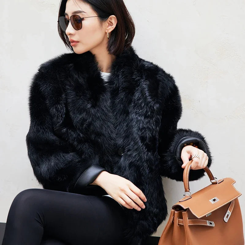 Women's Reversible cropped shearling jacket in Autographe, featuring a cut-on collar with shoulder darts, softly curled wool, and a dense, inky surface — From Borcelleclothes.