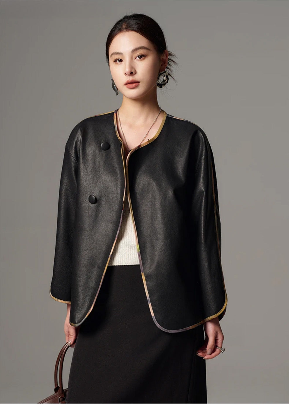 Frontal studio portrait of model in the Fluid Obsidian sheepskin Nappa kimono jacket — From Borcelleclothes.