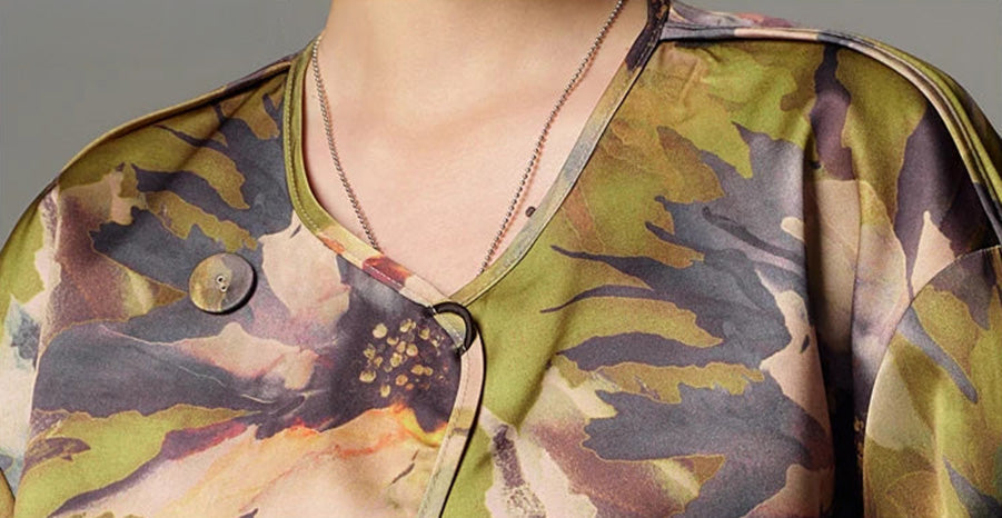 Detail of the asymmetric crossover neckline and loop closure on the Autumn Kiku printed side — From Borcelleclothes.