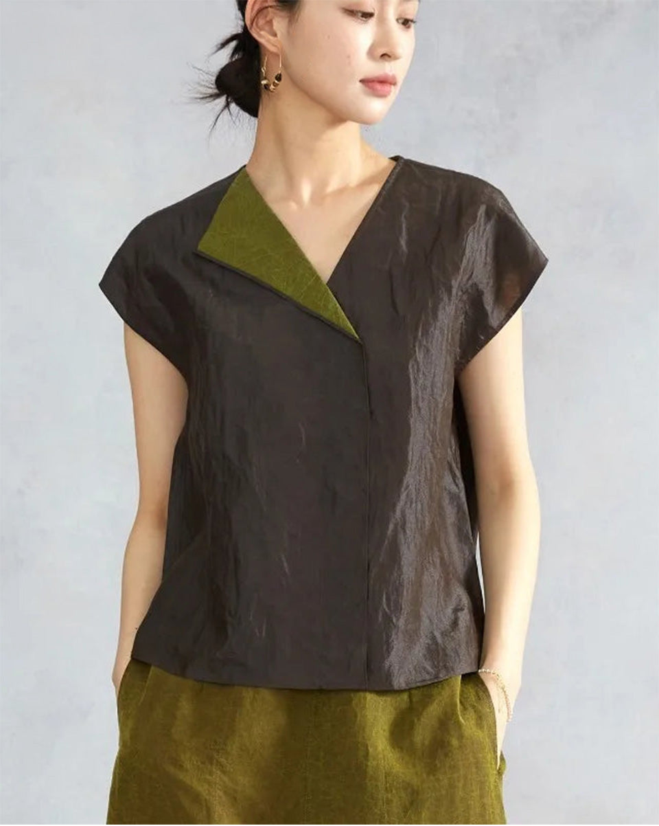 Woman posing in a black reversible Xiangyunsha silk top with hands in pockets — From Borcelleclothes.