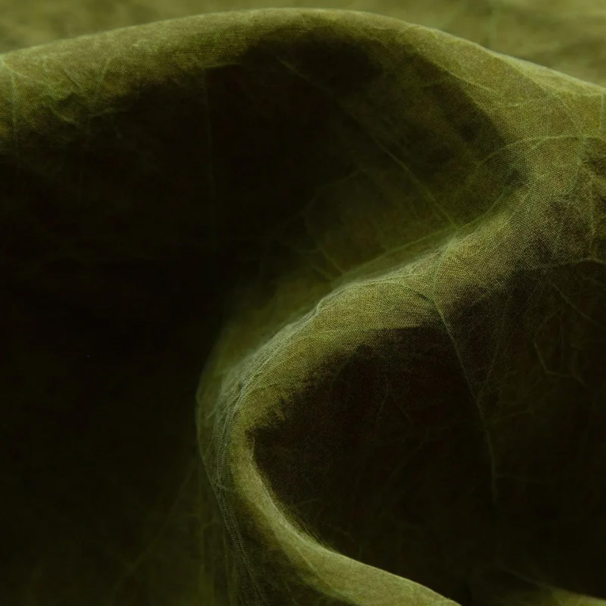 Textured olive Mulberry silk fabric fold of a reversible top — From Borcelleclothes.
