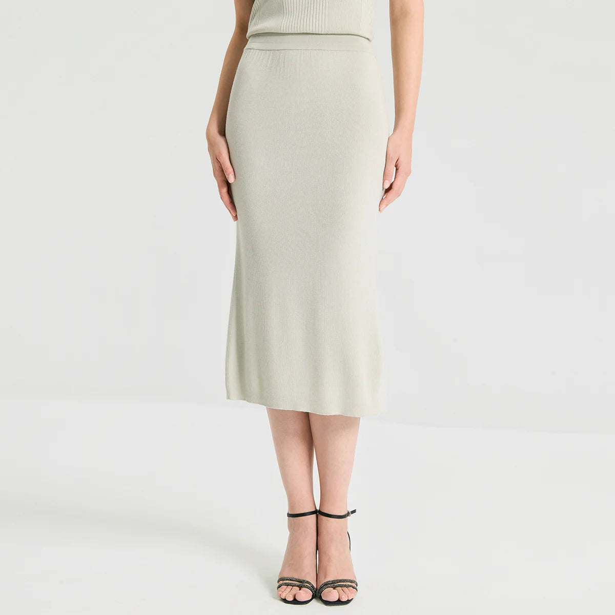 Women's sculptural midi skirt in rib wool-silk blend with a discreet side slit. Straight silhouette in Compliant Sage hue. — From Borcelleclothes.