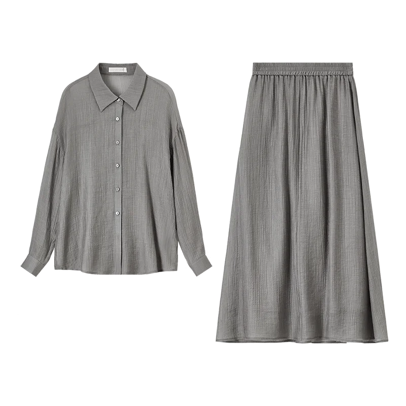 A flat lay of the semi-sheer graphite rain lyocell shirt and skirt set. — From Borcelleclothes.