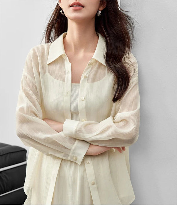 A woman standing with crossed arms in a semi-sheer pollen flight lyocell two-piece set. — From Borcelleclothes.