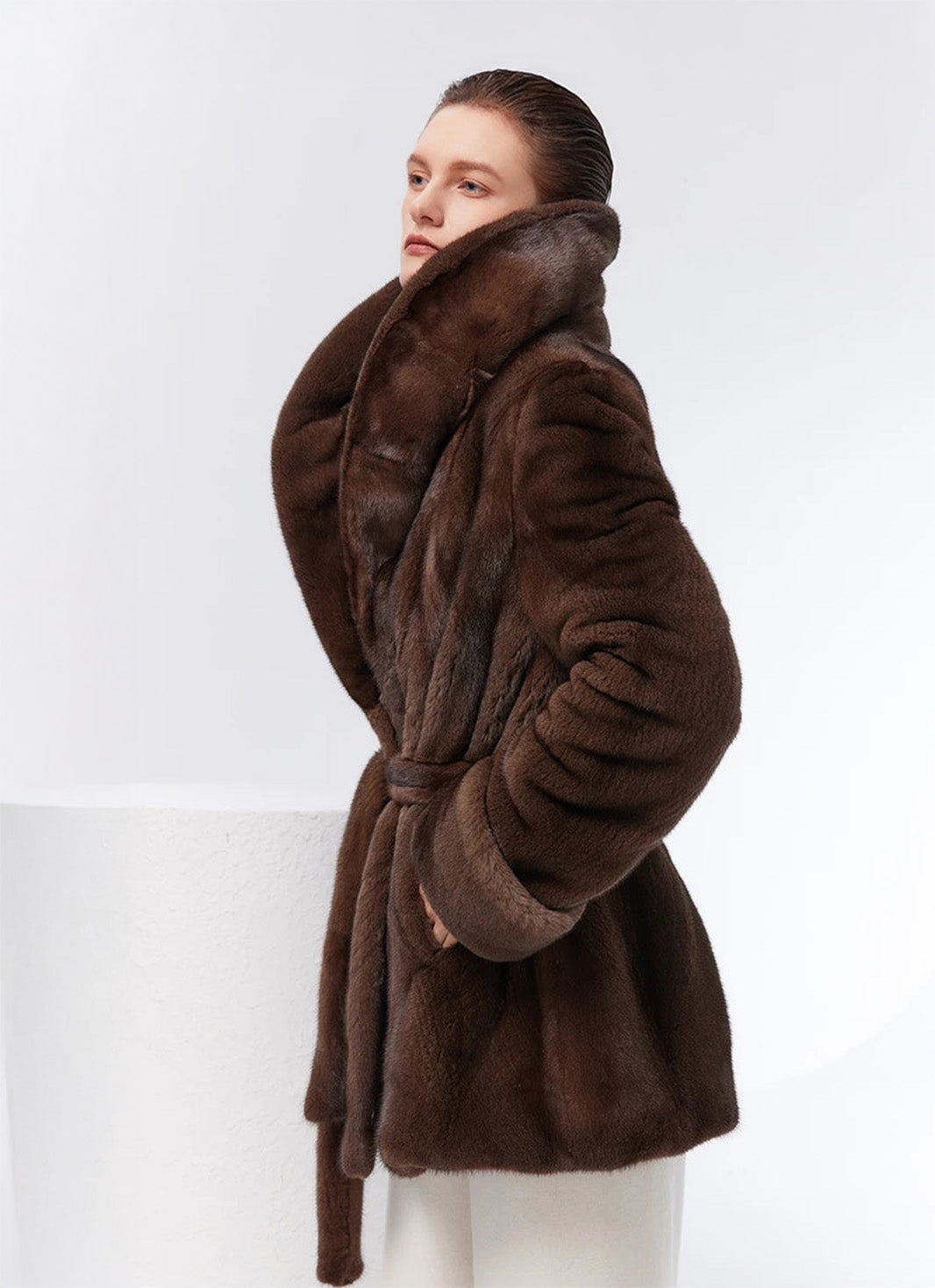 Model turned to side, collar raised on Eclipse mink coat — From Borcelleclothes.