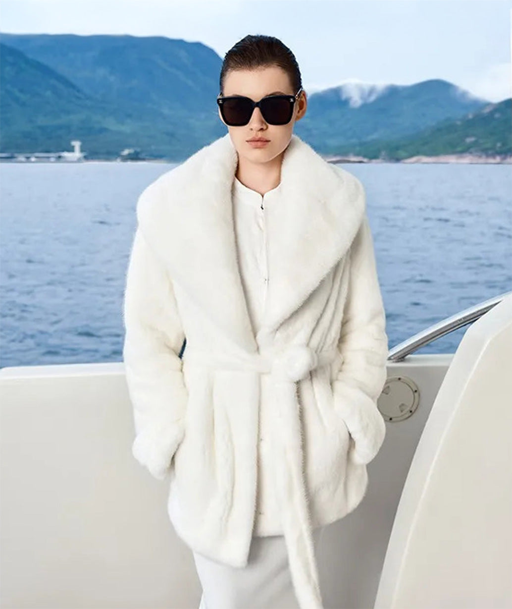 Women's sheared mink coat with wide shawl collar and self-tie belt, shown in White Amber. — From Borcelleclothes.