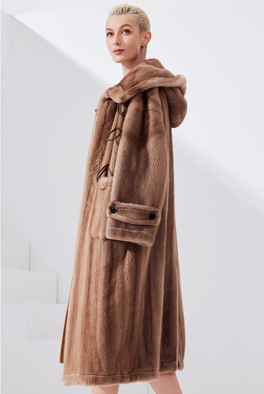 Side view of the sheared mink coat in Dreamcatcher color, showing the flare and length — From Borcelleclothes.