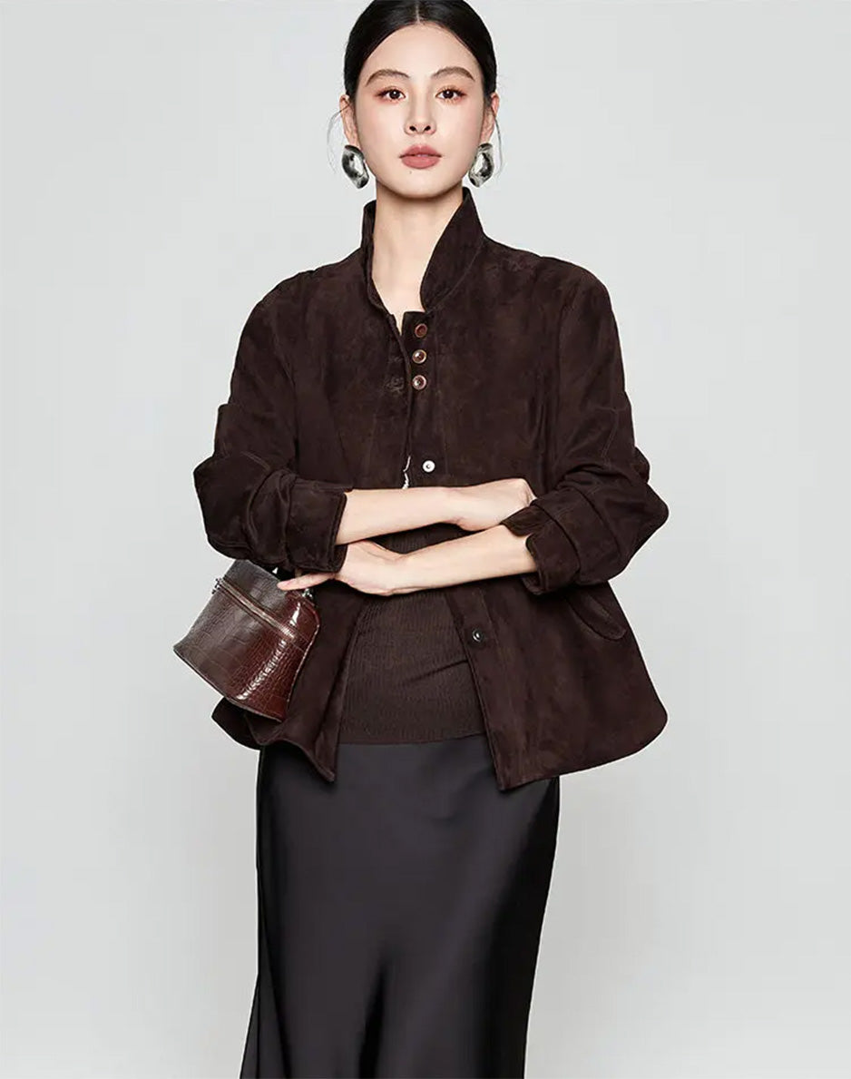 Front view of the sheepskin suede jacket in Comfortable Wenge with the model crossing her arms, showing the upper button accent — From Borcelleclothes.