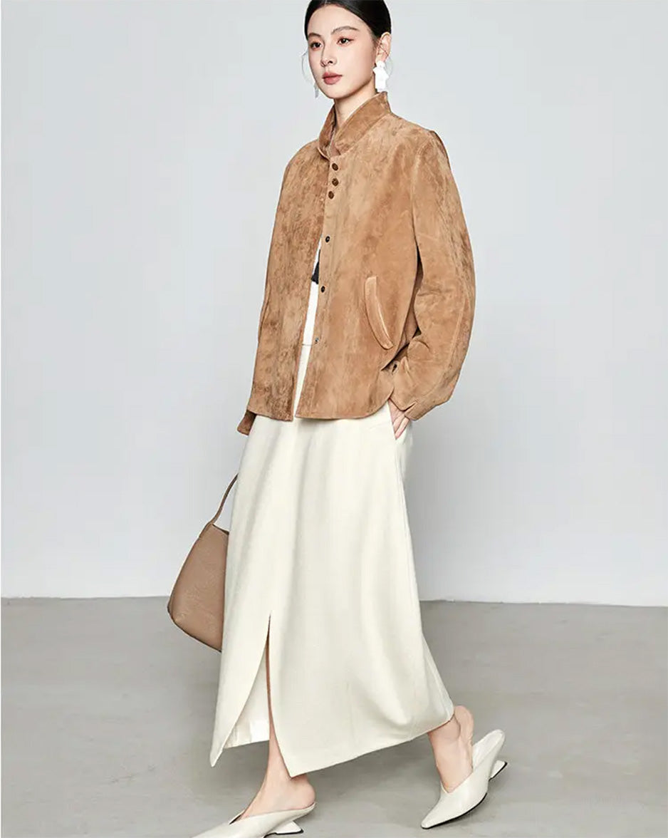 Dynamic side profile of the Moiré Trace suede jacket in motion, displaying the natural fluid drape of the reverse sheepskin — From Borcelleclothes.