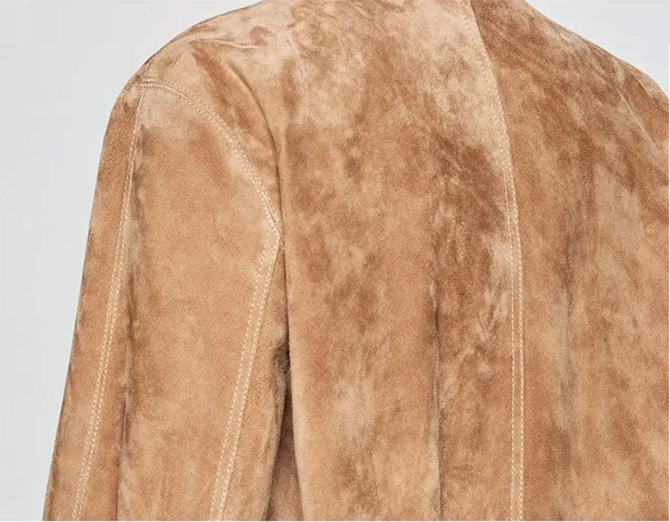 Close-up of the upper back on the Moiré Trace suede jacket, highlighting the neat tailoring along the collar and shoulder seams — From Borcelleclothes.