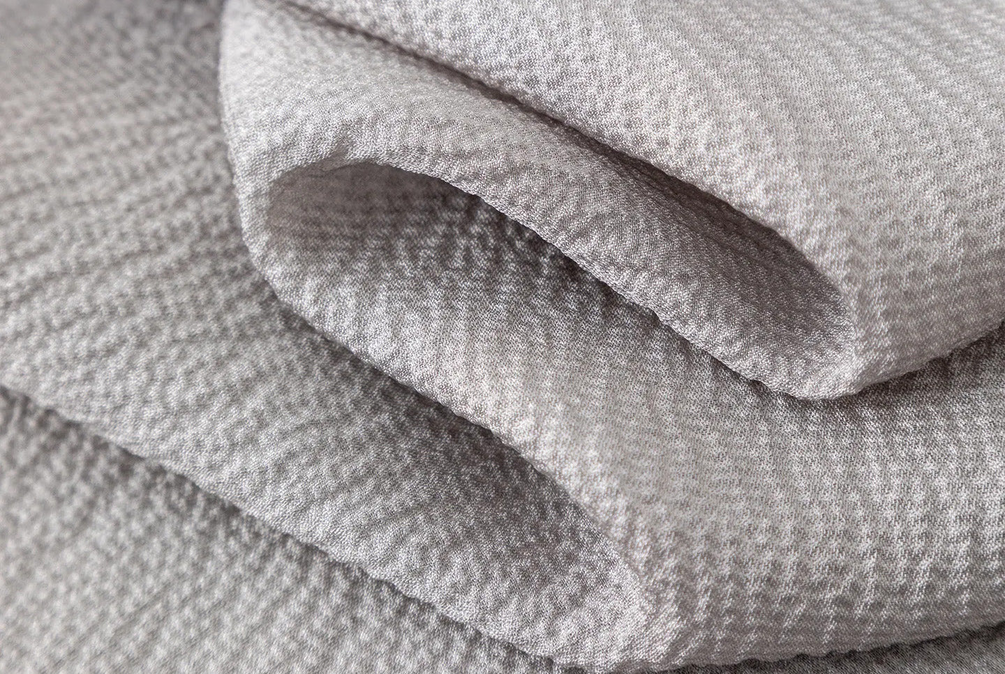 Serpentine draped silk georgette texture in Where Lives Nacre demonstrating depth and light absorption. — From Borcelleclothes.