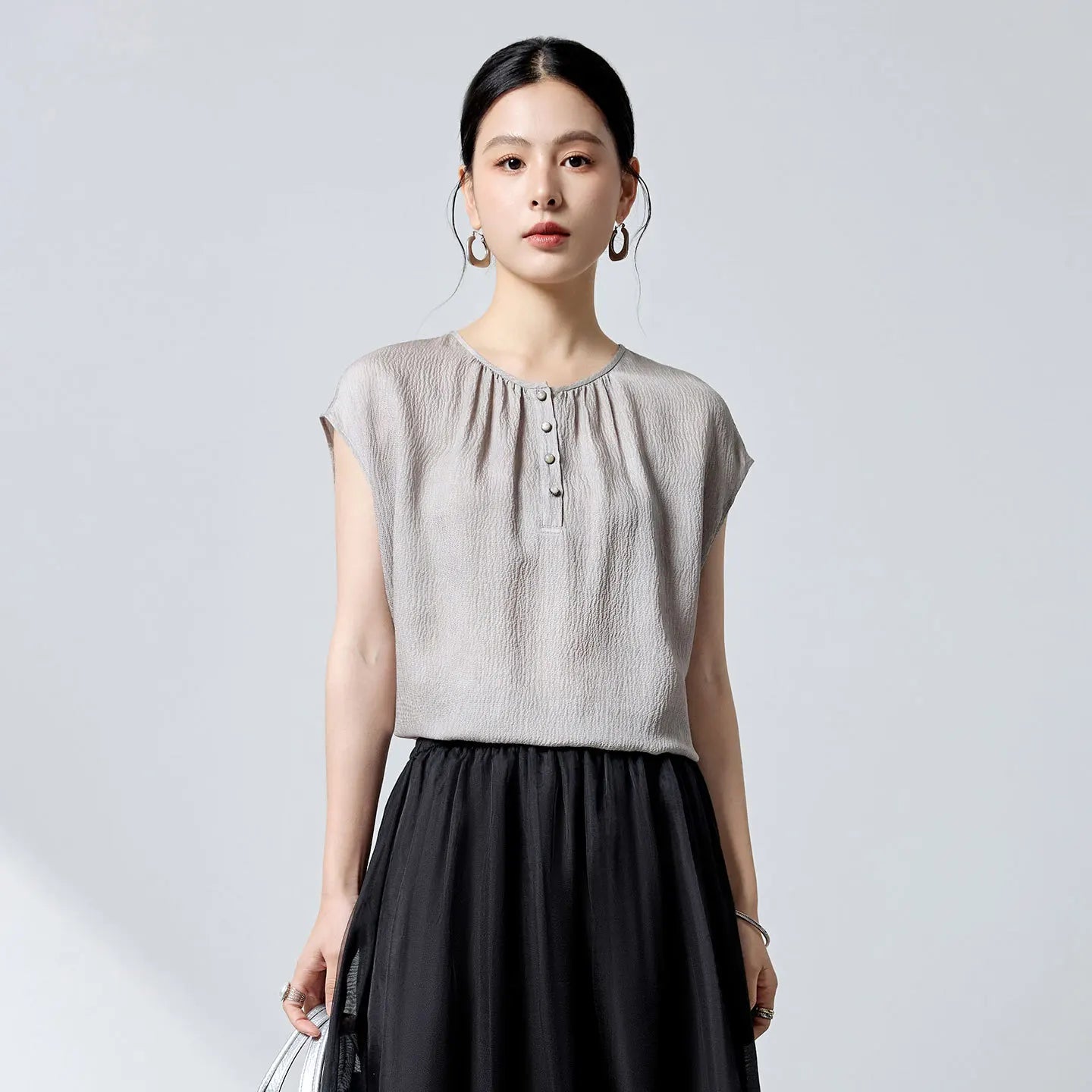 Women's Loose-fitting 14 Momme Mulberry silk georgette blouse in Where Lives Nacre, with a micro-puckered jacquard texture. Features a Henley placket with mother-of-pearl cabochon buttons. — From Borcelleclothes.