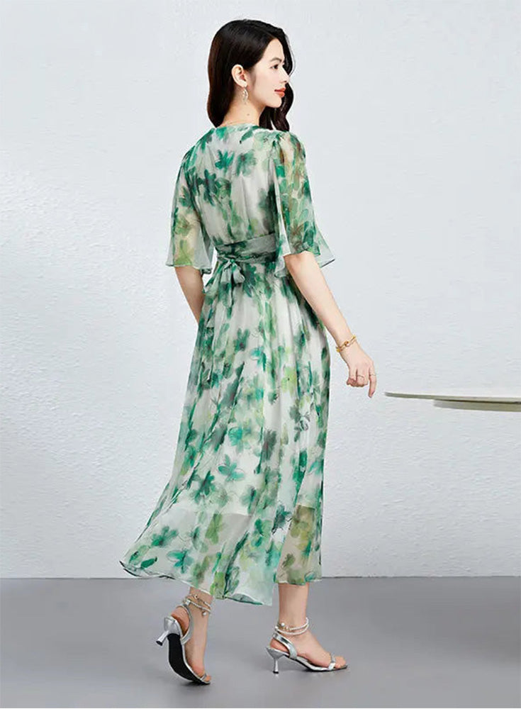 A woman walking in a Jade Breeze silk georgette dress, showcasing the elegant movement of the 10 momme mulberry silk — From Borcelleclothes.