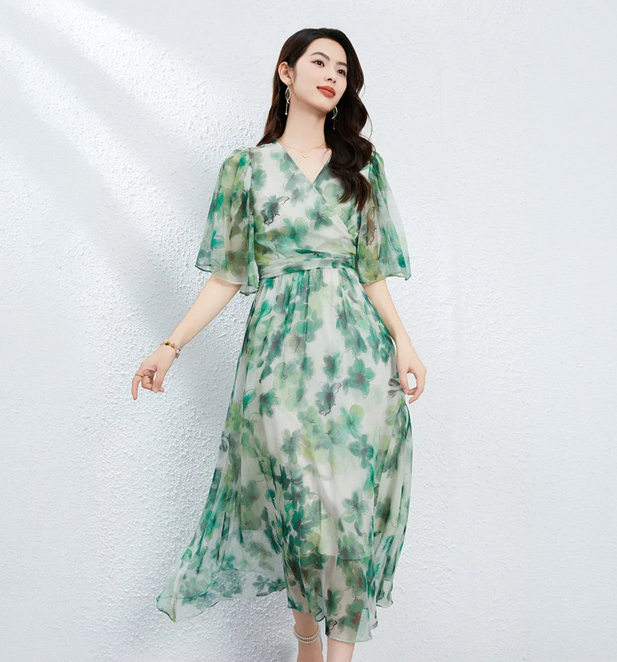 Translucent Jade Breeze silk georgette midi dress with a wrap bodice, 1/2 flutter sleeves, and watercolor jade floral patterns on a misty background. — From Borcelleclothes.