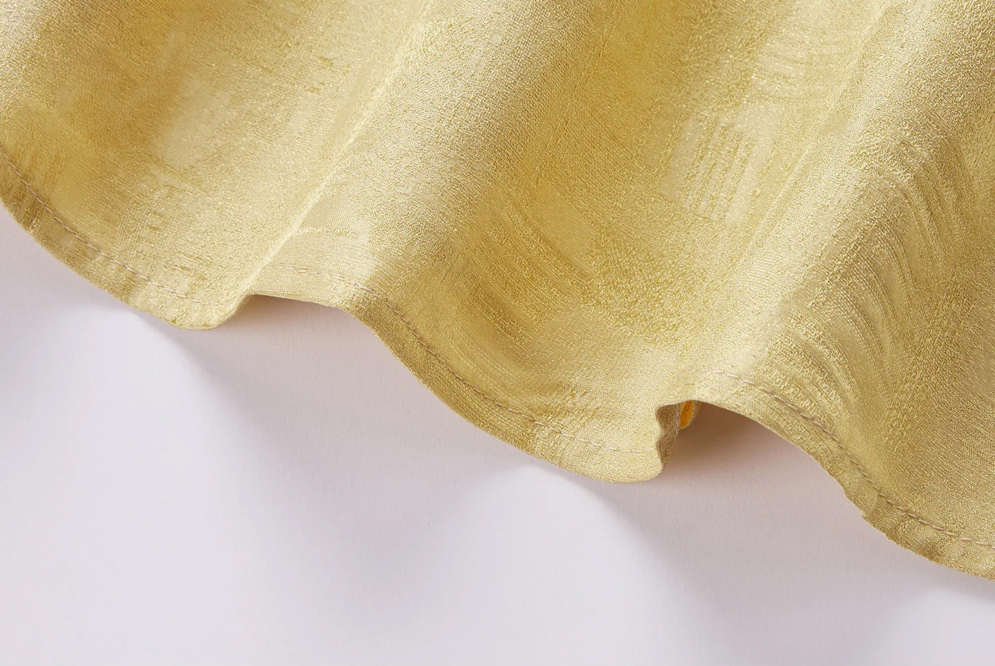 Macro detail of the neatly turned bottom hemline and substantial drape of Hakea Mulberry silk Sangbo jacquard — From Borcelleclothes.