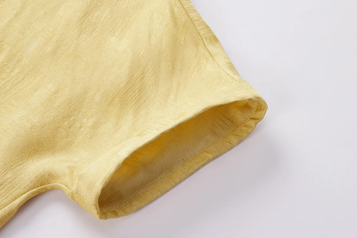 Close-up of tailored sleeve cuff on a Hakea Mulberry silk Sangbo jacquard blouse showing fine stitching and textured weave — From Borcelleclothes.