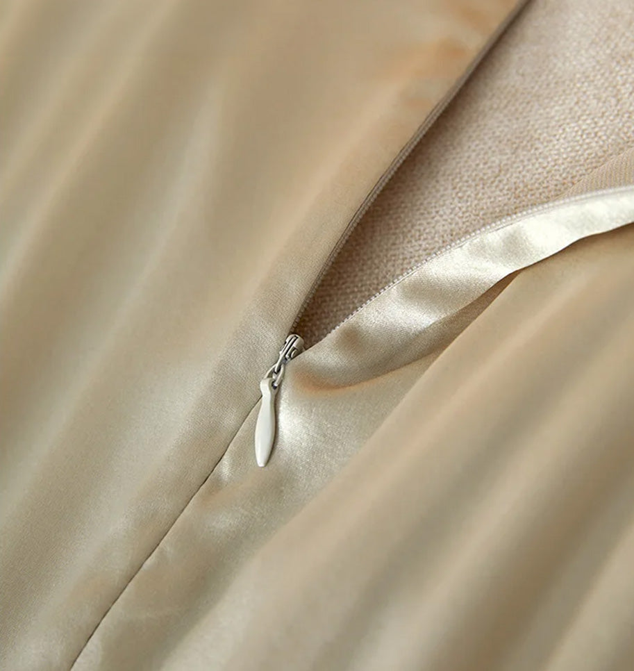 Quality invisible back zipper partially unzipped on the champagne silk dress — From Borcelleclothes.