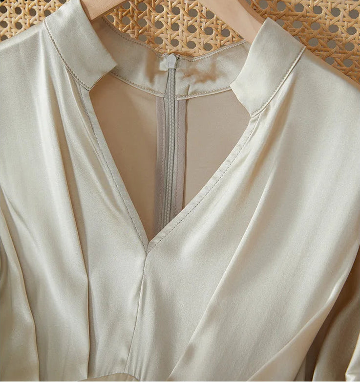 Detail of the elegant stand-up collar and V-neckline on the Taste of Champagne silk dress — From Borcelleclothes.