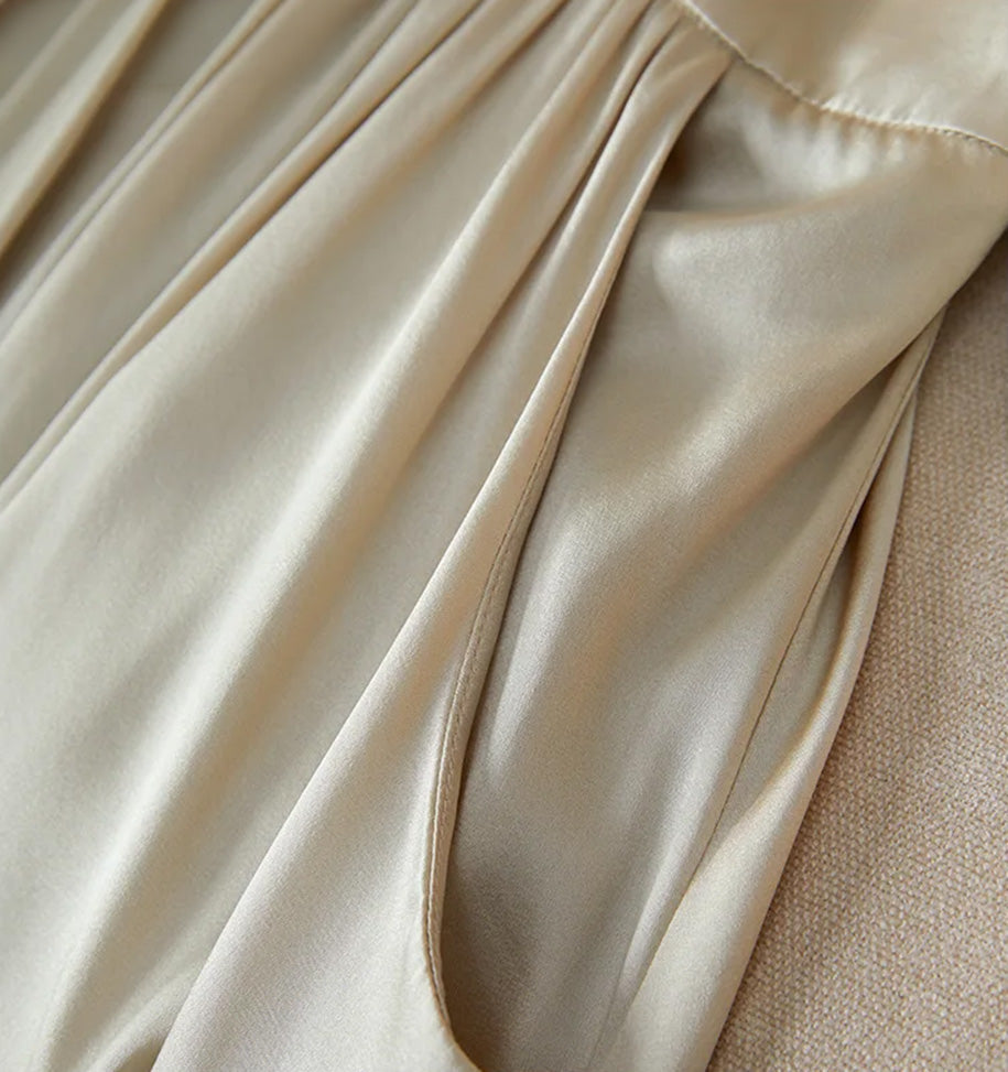 Detailed view of the deep slash pocket with its refined curved entry — From Borcelleclothes.
