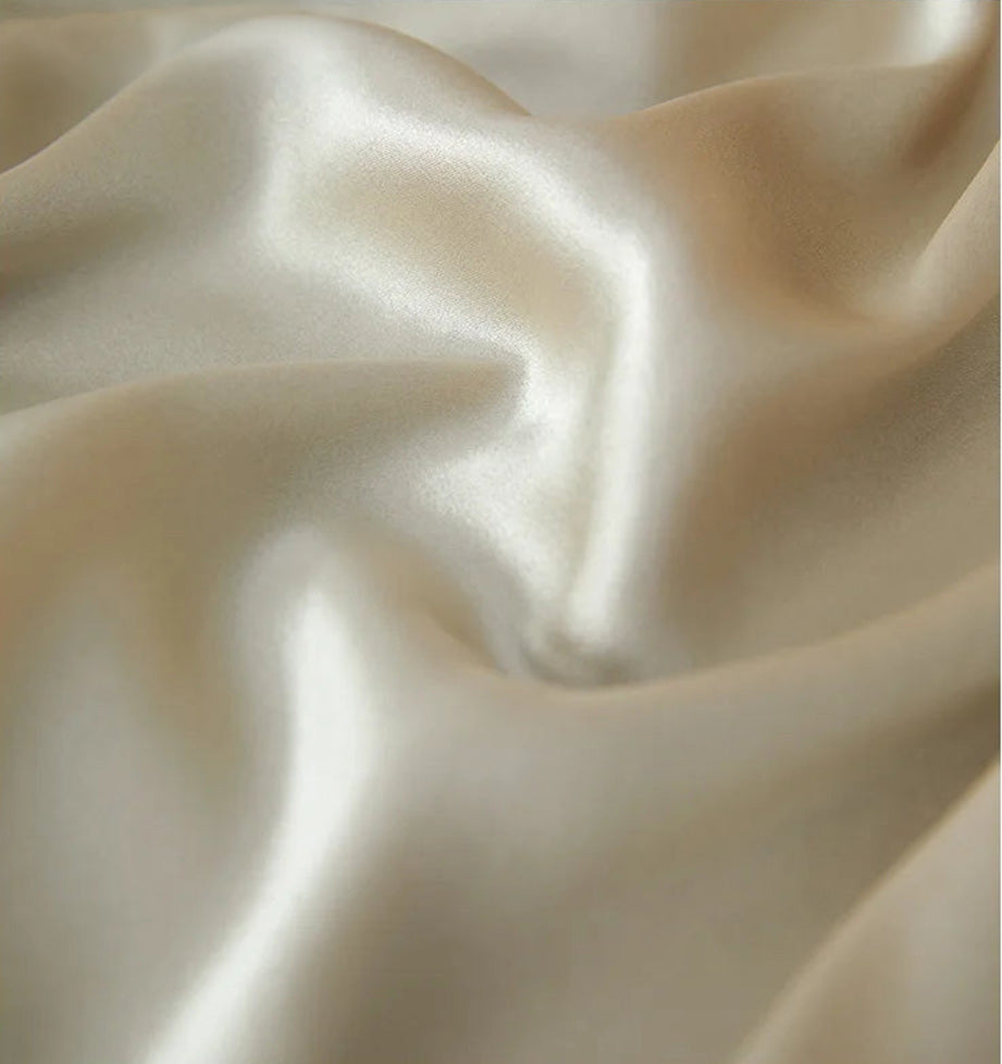 Close-up of the liquid-like wave texture of 19mm Mulberry silk in Taste of Champagne — From Borcelleclothes.