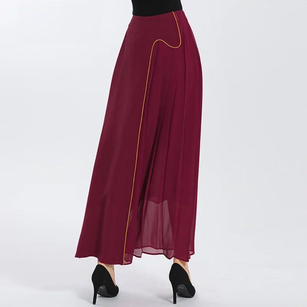 Back view on model taking a step, showcasing the interplay of heavy structured silk and fluid pleats — From Borcelleclothes.