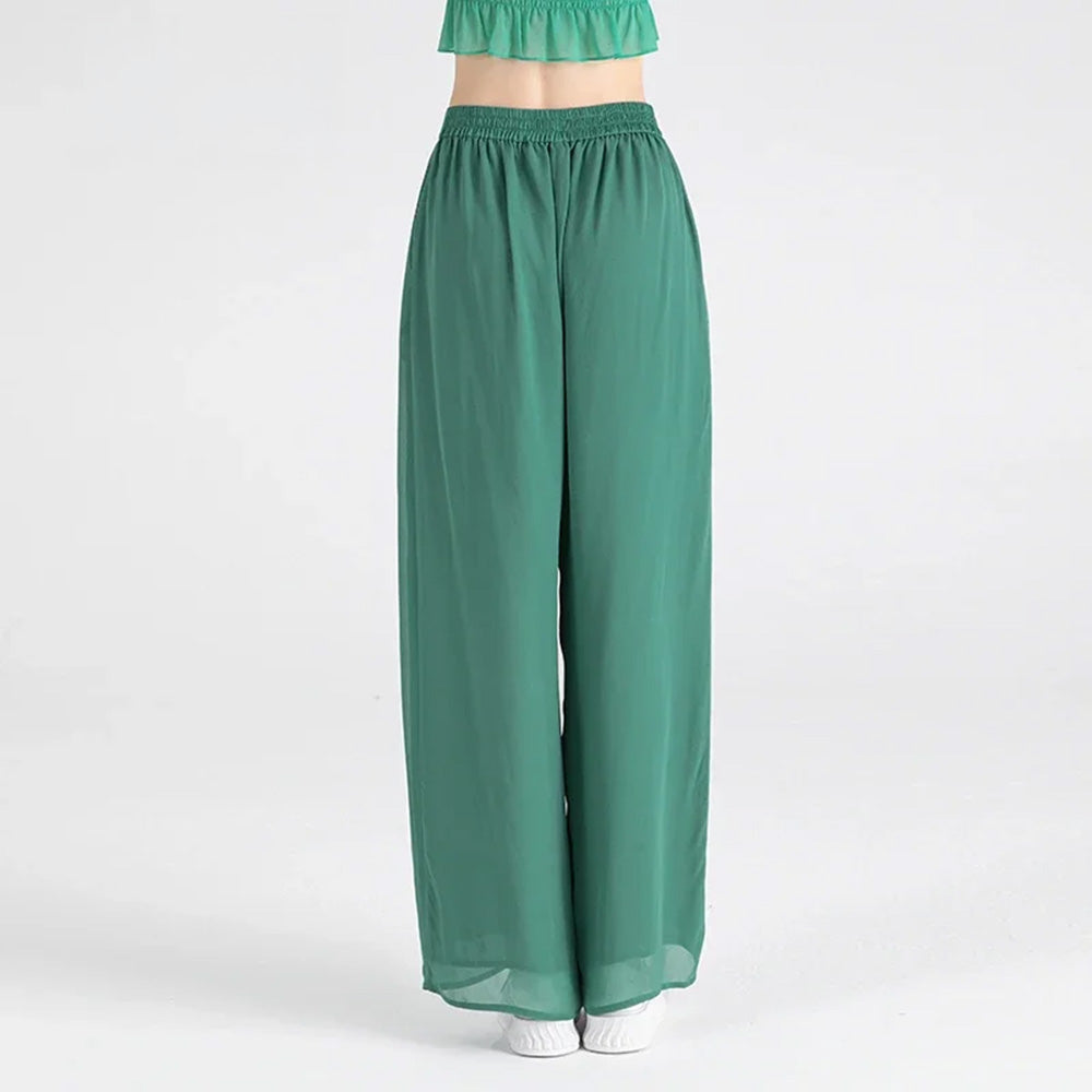 Back view of the Calm Jade wide-leg silk trousers featuring the comfortable elasticated waistband — From Borcelleclothes. 