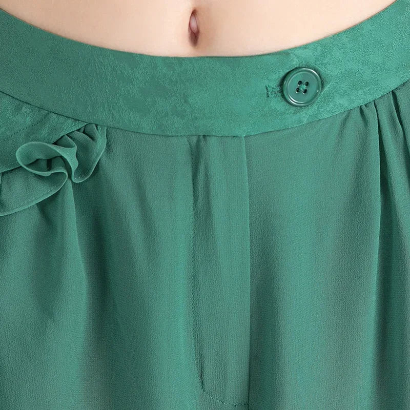 Close-up of the front marble-patterned jacquard waistband secured with a color-matched 4-hole button — From Borcelleclothes.