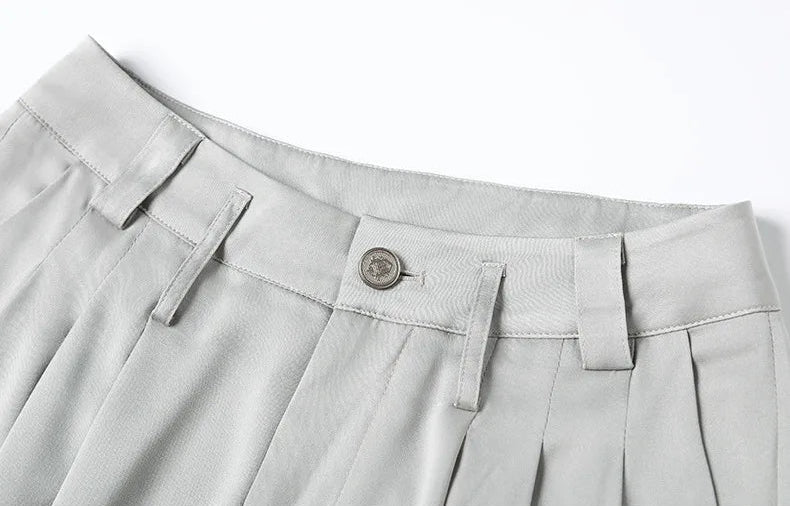 Close-up of the front waistband, dual-level belt loops, and metal button. — Borcelleclothes.