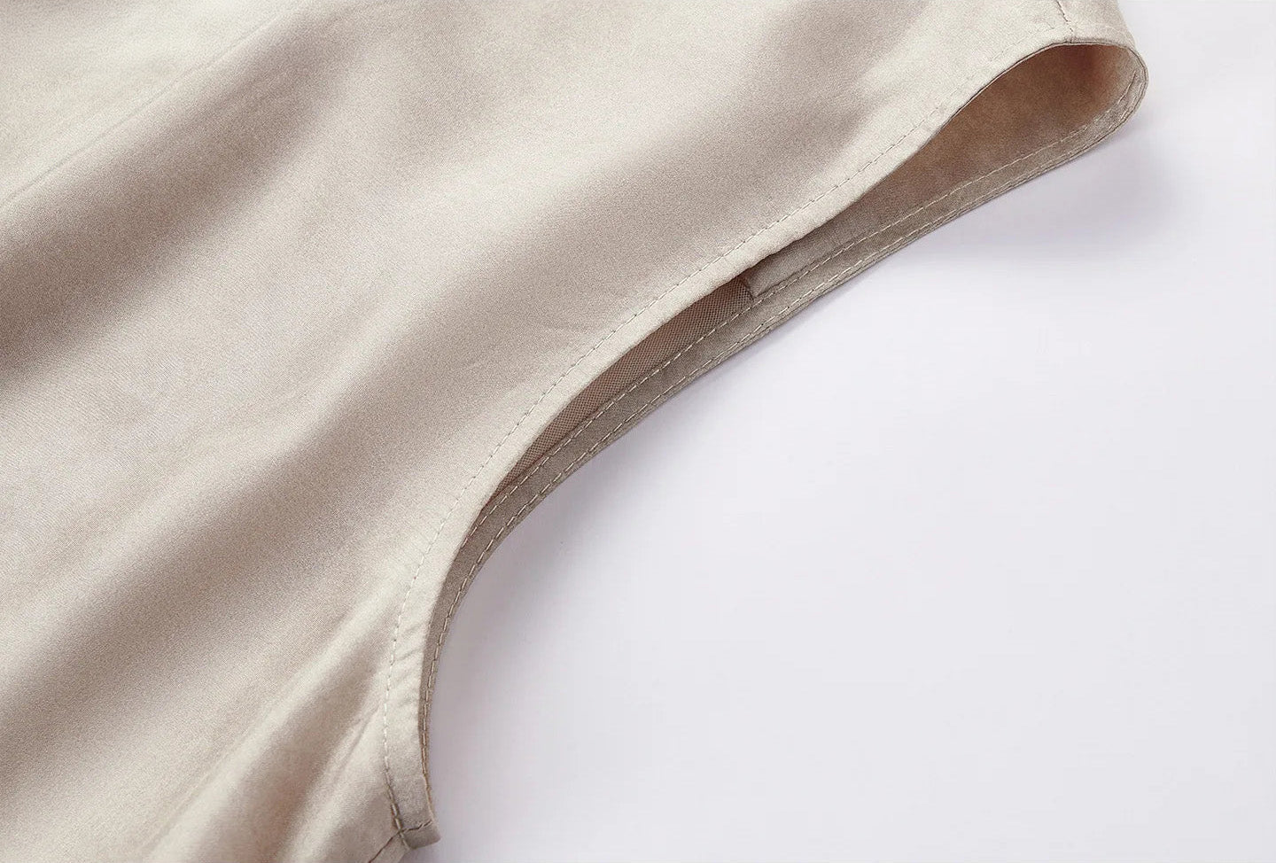 Detailed close-up of the clean-finished armhole on the sleeveless Mulberry Habotai silk jacket in Whispering Wind — From Borcelleclothes.