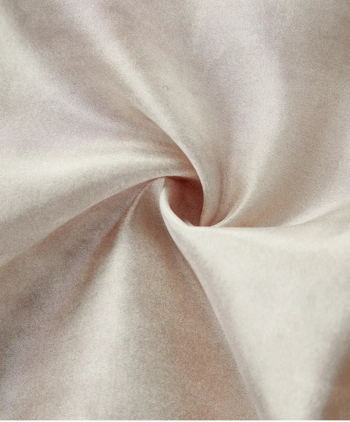 Close-up texture of the women's sleeveless Mulberry Habotai silk blouson jacket spirally folded in Whispering Wind — From Borcelleclothes.