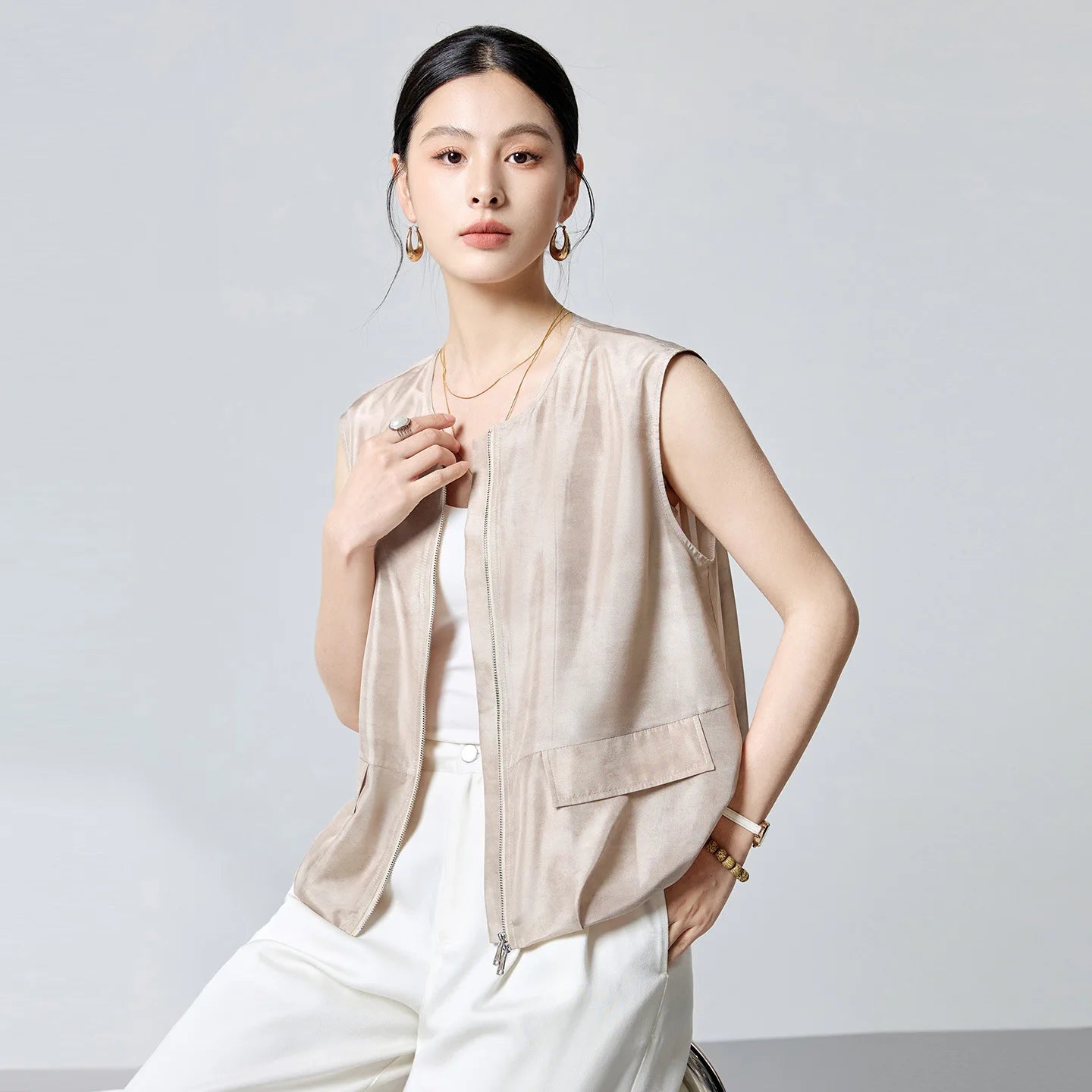 Women's Sleeveless blouson jacket in 100% Mulberry Habotai silk. Featuring a two-way front zip, powdery soft touch, and a relaxed silhouette in Whispering Wind. — From Borcelleclothes.