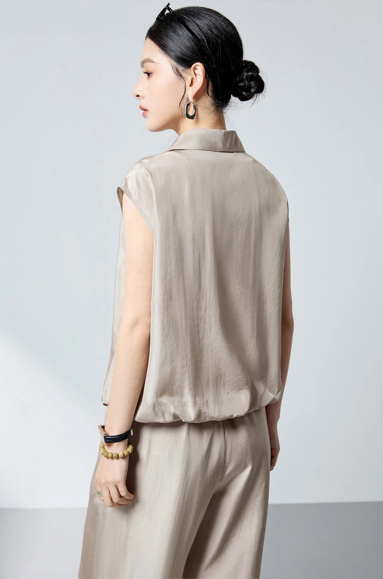 Back view of model wearing the Morning Draft sleeveless Mulberry silk blouson with clean draped cut — From Borcelleclothes.