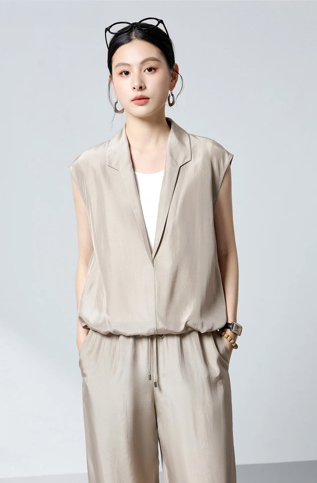 Model styled in Morning Draft layered Mulberry silk blouse with hands in pockets of matching silk pants — From Borcelleclothes.