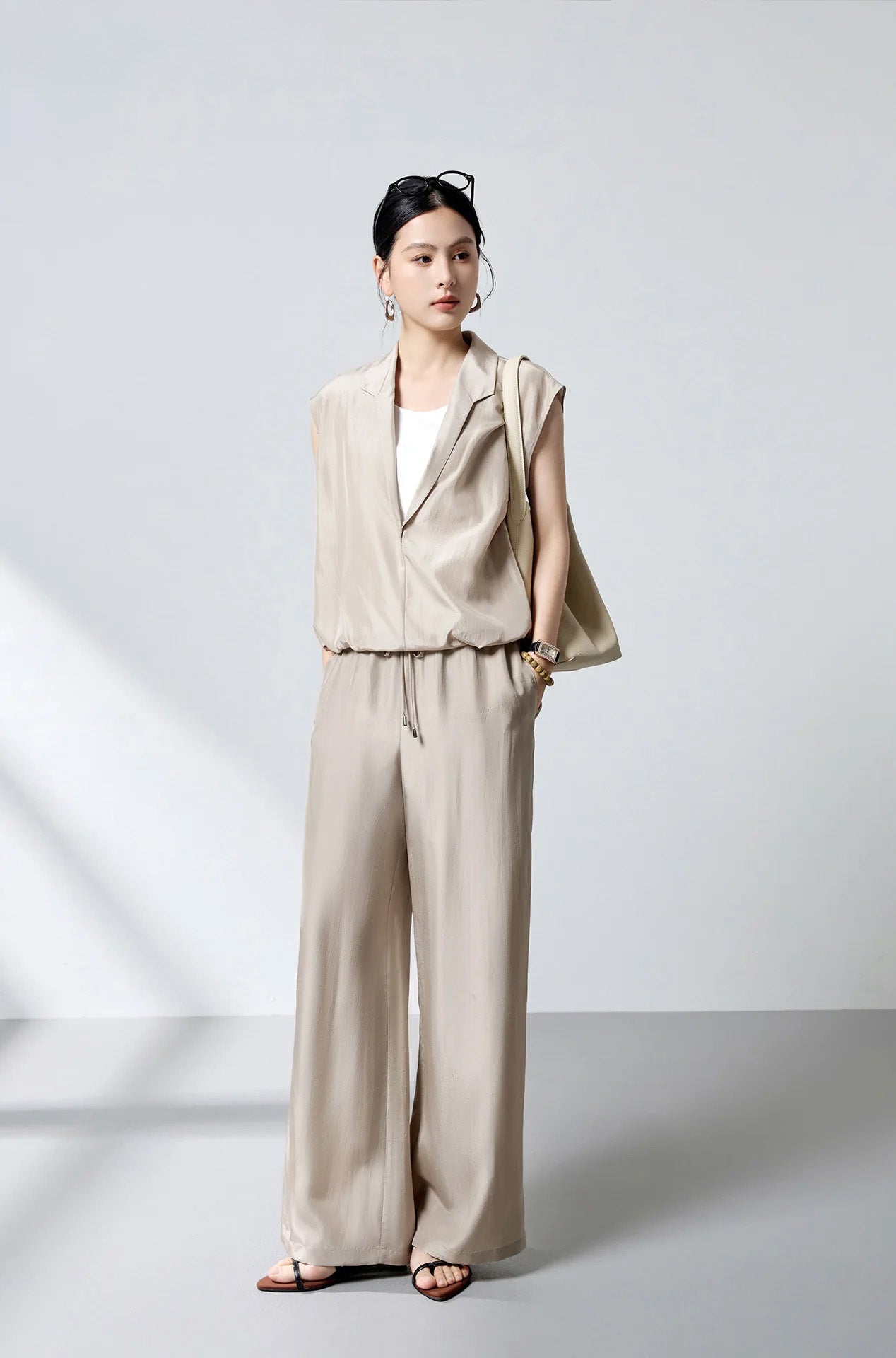 Full-height editorial view of model in Morning Draft layered silk blouse paired with matching trousers — From Borcelleclothes.