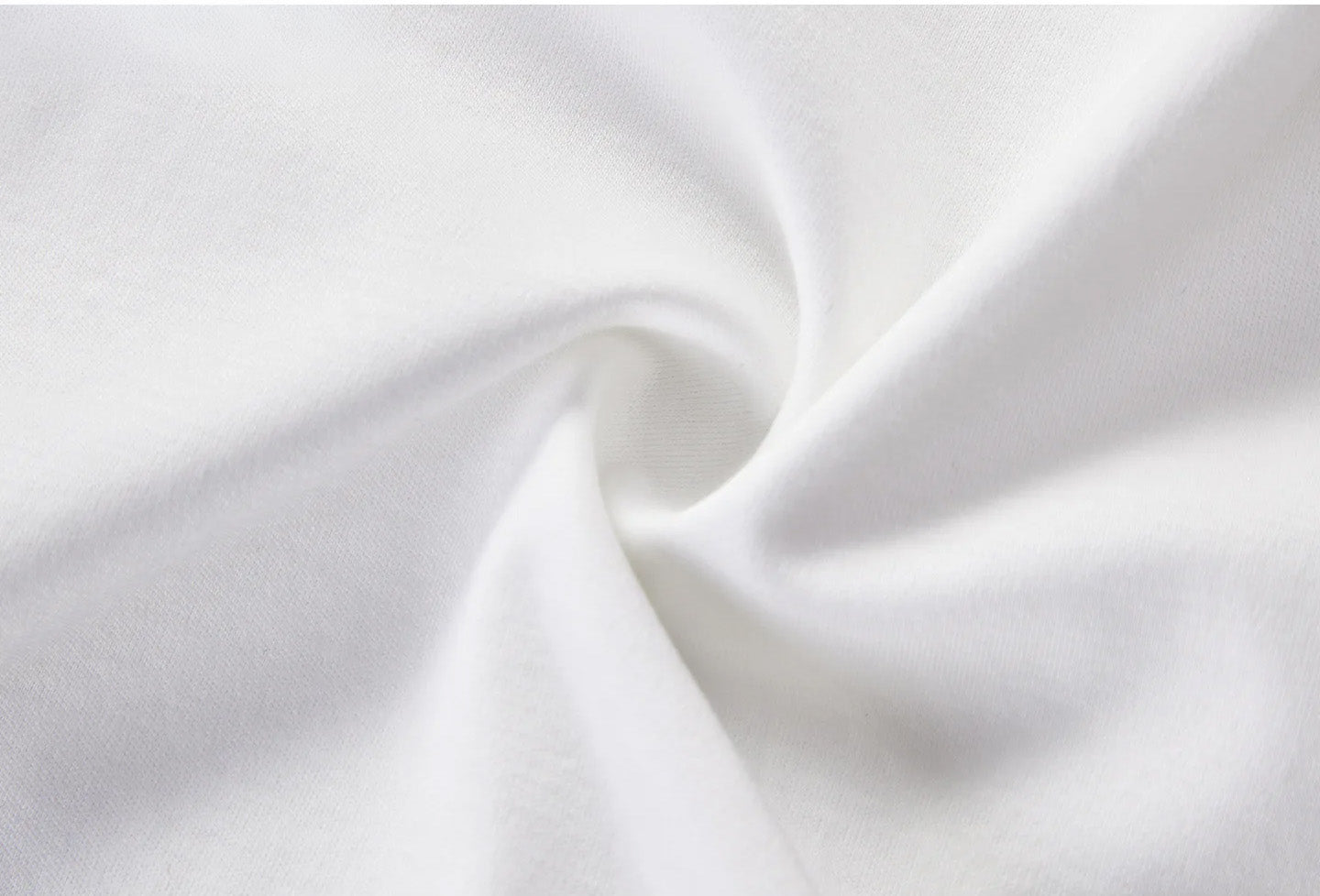 Close-up texture of soft white inner tank top fabric swirled in a spiral fold — From Borcelleclothes.