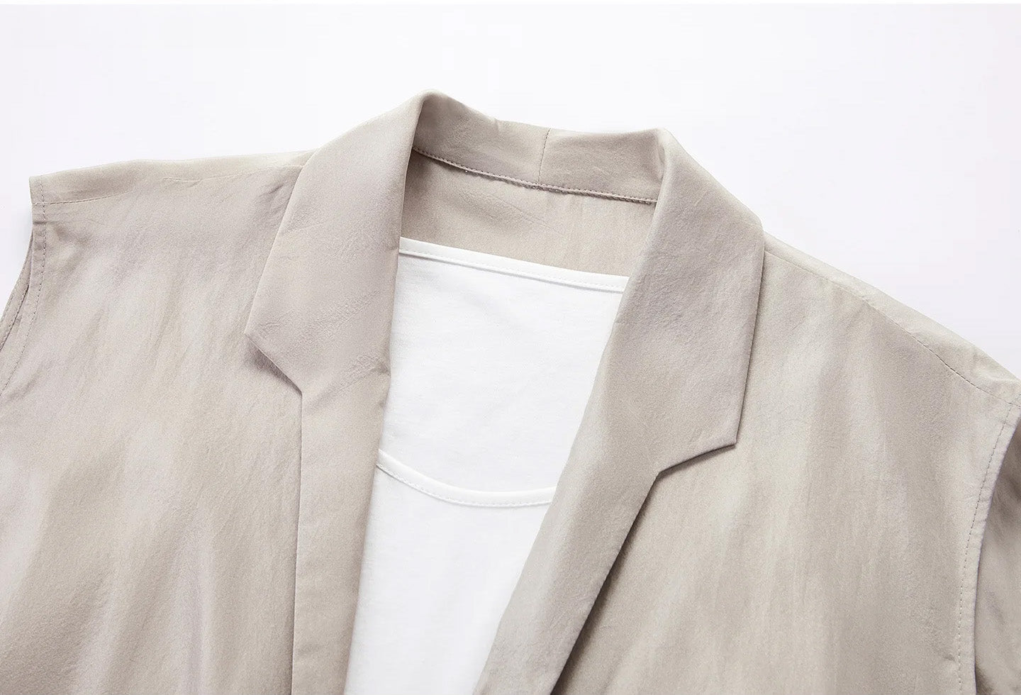 Front close-up of architectural stepped shawl collar and layered white neckline on Morning Draft silk blouse — From Borcelleclothes.