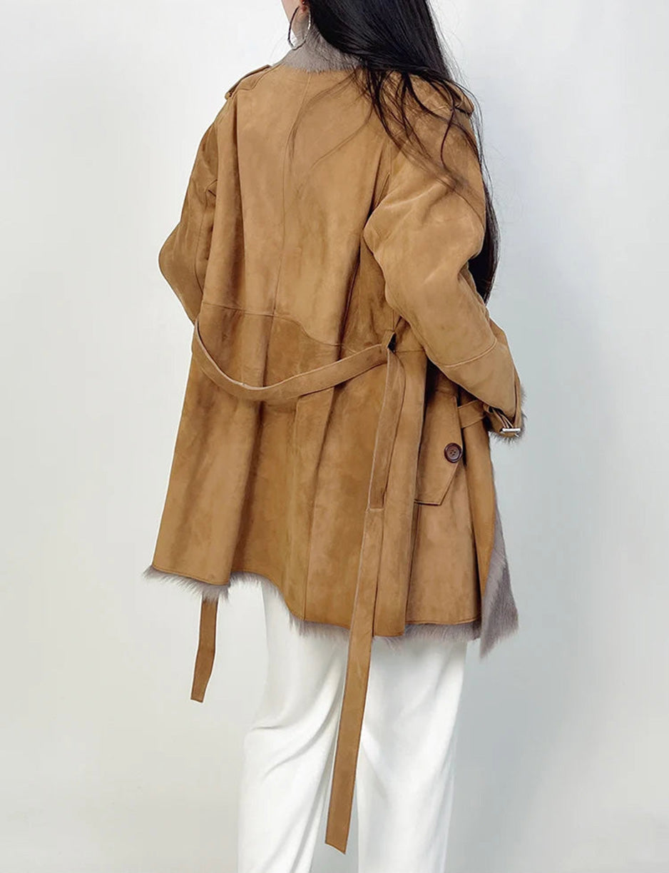 Back view of the storm flap goatskin coat worn by model — From Borcelleclothes.