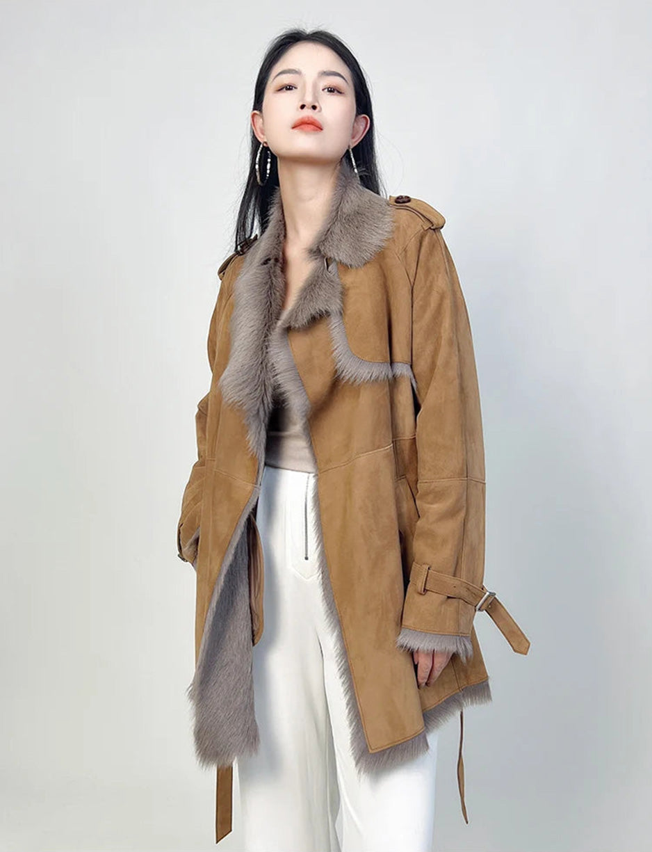 Woman turned slightly to the side, wearing Gold Ransom goatskin coat — From Borcelleclothes.