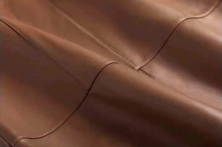 Wave-folded leather texture and grain of a genuine sheepskin midi skirt in Bay Grace — From Borcelleclothes.