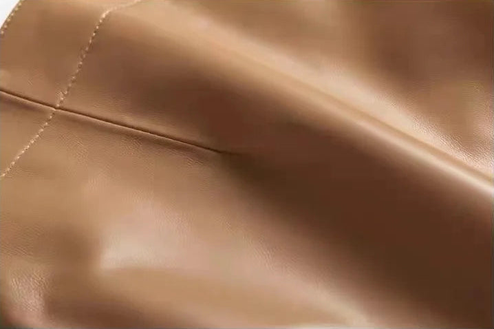 Close-up of the right front dart and precise stitching on a sheepskin skirt in Palomino — From Borcelleclothes.
