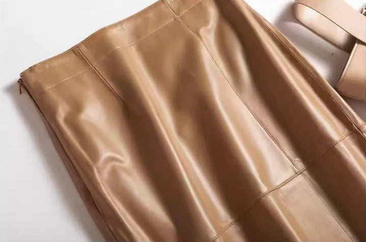 Upper section and smooth waistband finish of a straight sheepskin midi skirt in Palomino — From Borcelleclothes.