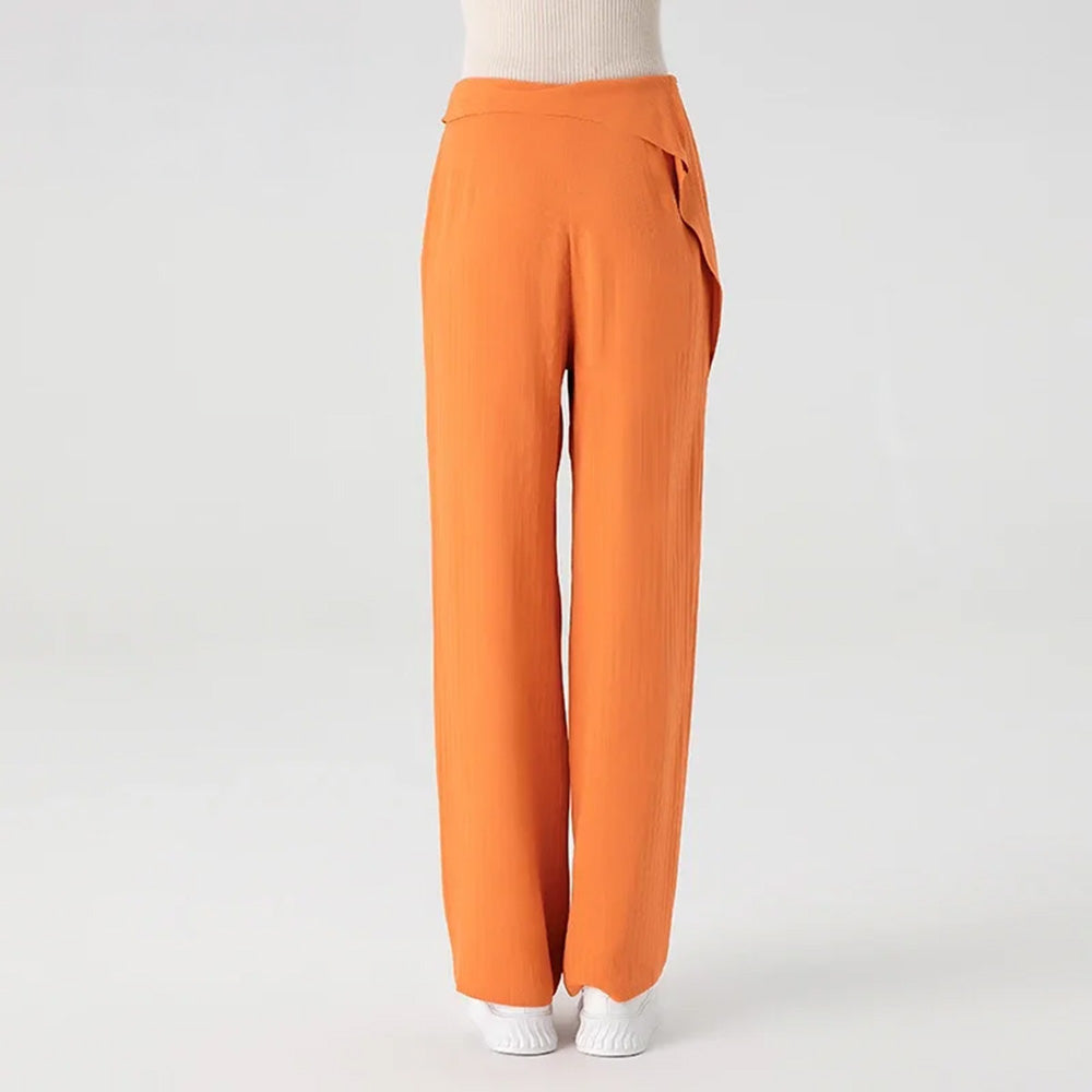 Back view of a woman wearing heavyweight Fragrant Cloud silk jacquard trousers, highlighting the smooth fit around the waist and hips — From Borcelleclothes.
